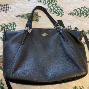 Coach Black satchel with crossbody strap.
